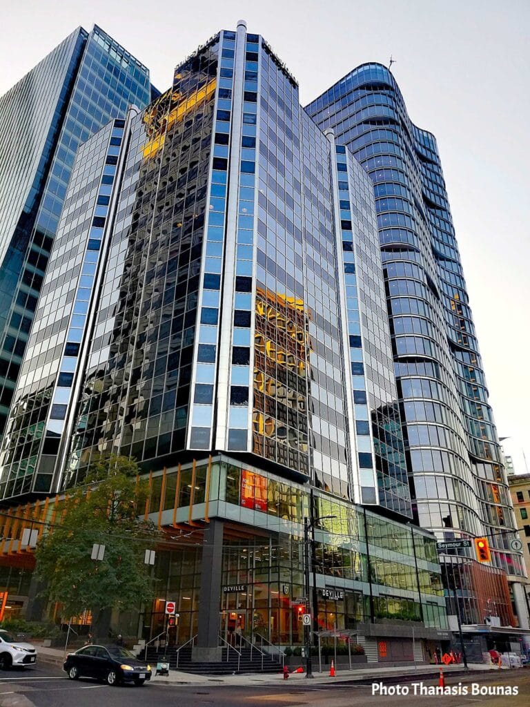 Modern skyscrapers in downtown Vancouver reflecting the city and sky