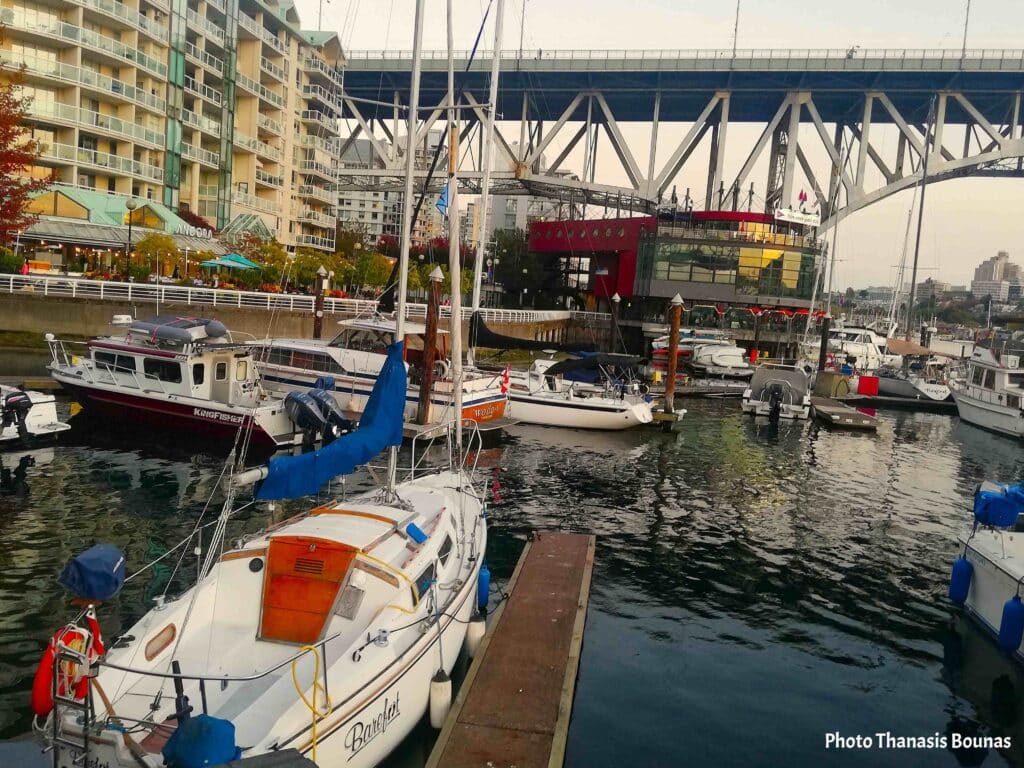 Boats at marina in False Creek with Granville Bridge and Vancouver waterfront skyline British Columbia Canada
