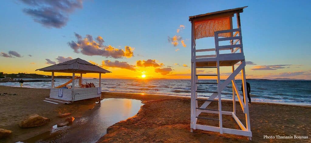 Sunset at Athens Riviera Greece with lifeguard tower and beach view