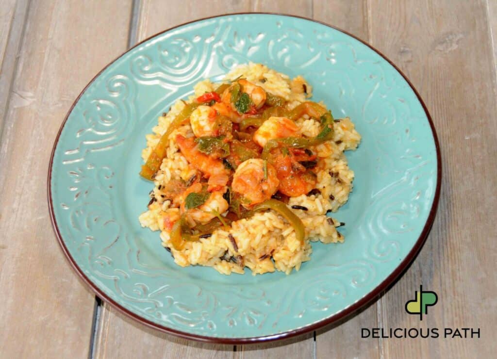 Shrimp with rice on turquoise plate symbolizing anticipation in sailing psychology and mindful travel