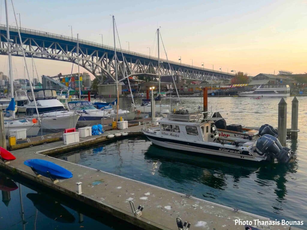 Boats at marina False Creek with Granville Bridge Vancouver British Columbia Canada
