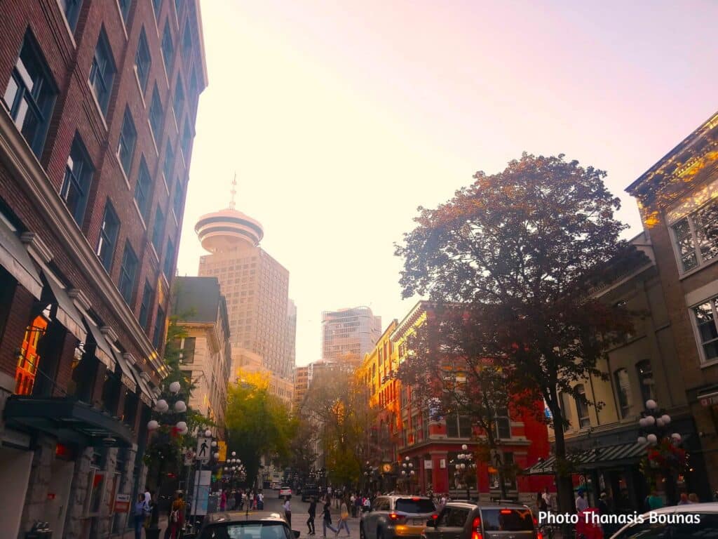 Street view of Gastown with Harbour Centre Tower in downtown Vancouver British Columbia Canada
