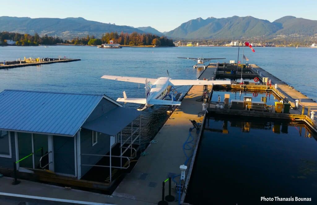 Harbour Air Vancouver seaplane dock with floatplanes and waterfront mountains view