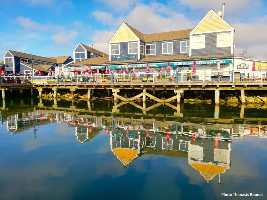 Steveston Harbour Vancouver waterfront with fishing village buildings and reflections on calm water