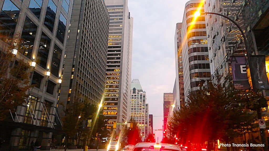 Evening traffic and illuminated skyscrapers in downtown Vancouver British Columbia Canada
