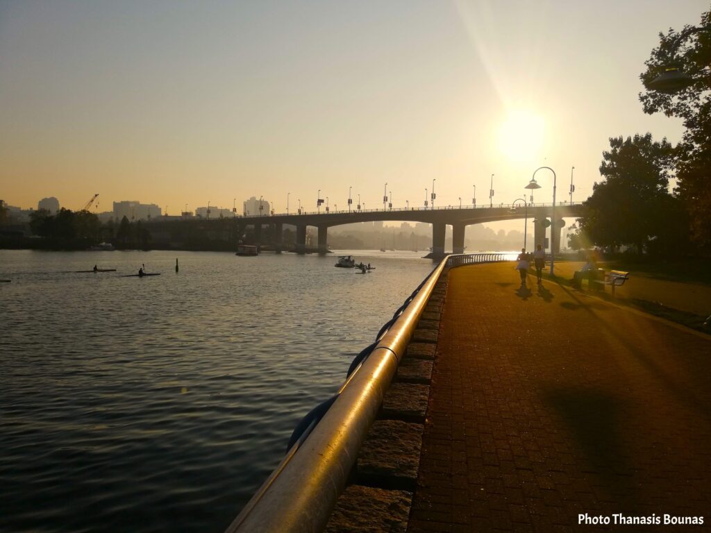 False Creek Vancouver waterfront walkway with sunset and bridge view