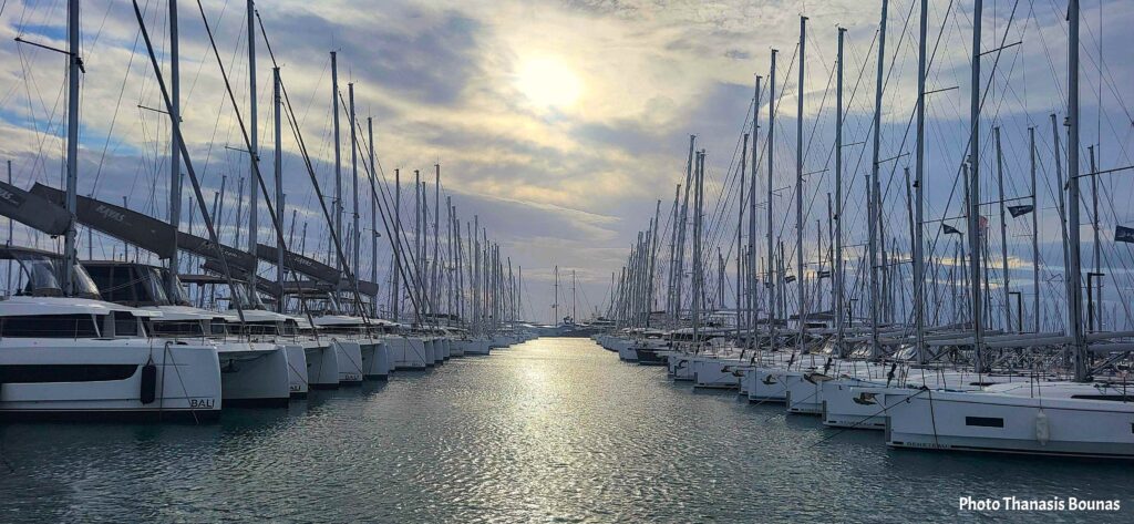 Sailboats aligned in a marina channel symbolizing curiosity, sailing, and the psychology of travel