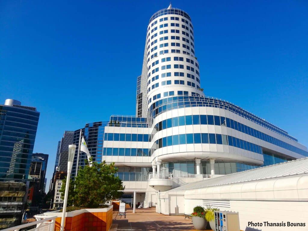 Modern cylindrical glass tower building at Canada Place waterfront in Vancouver British Columbia Canada
