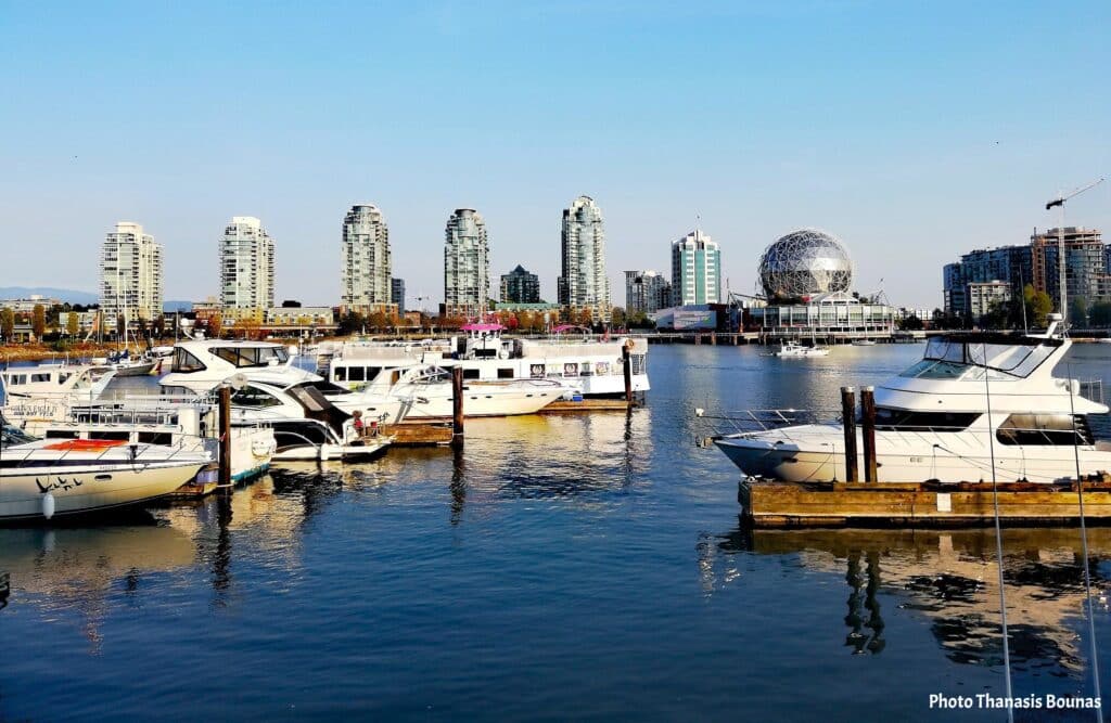 Boats at marina False Creek with Science World and Vancouver skyline British Columbia Canada