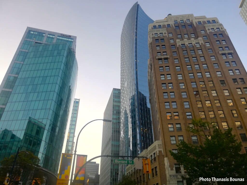Glass skyscrapers and historic buildings along Burrard Street in downtown Vancouver British Columbia Canada
