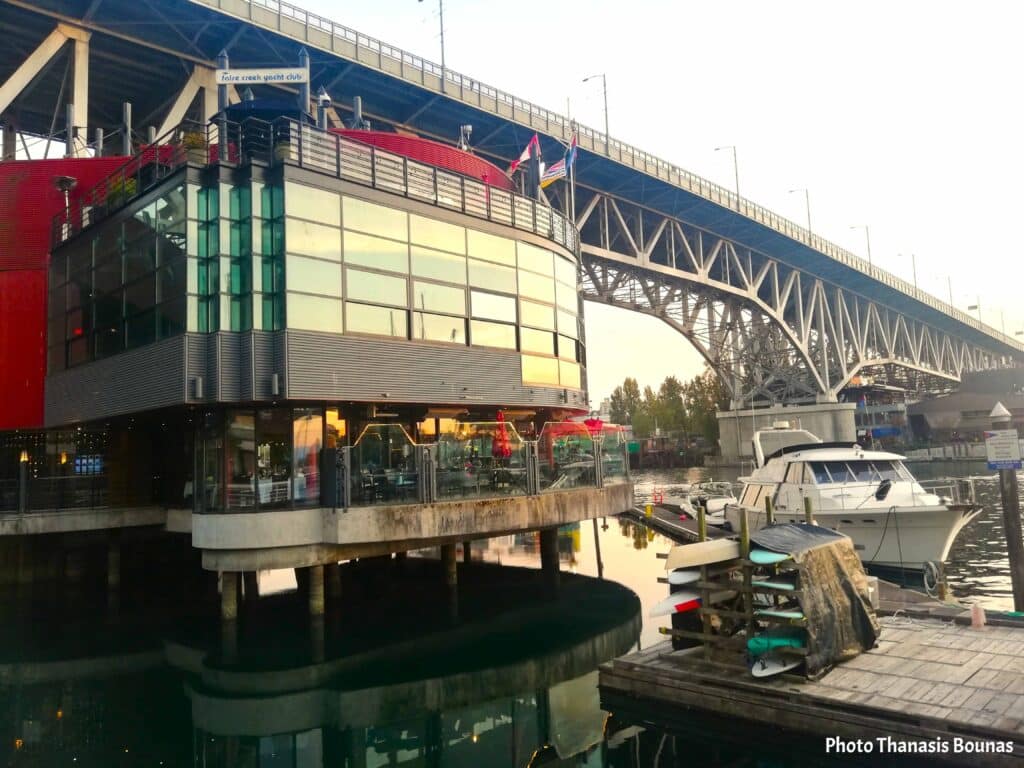 False Creek Yacht Club Vancouver under Granville Bridge with boats and waterfront reflections