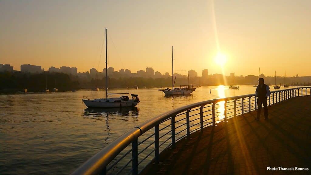 Sunset over False Creek with sailboats and Vancouver skyline Vancouver British Columbia Canada