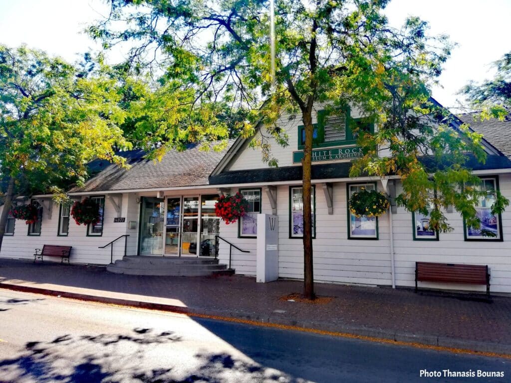 White Rock Museum and Archives building in British Columbia Canada with trees and calm street view