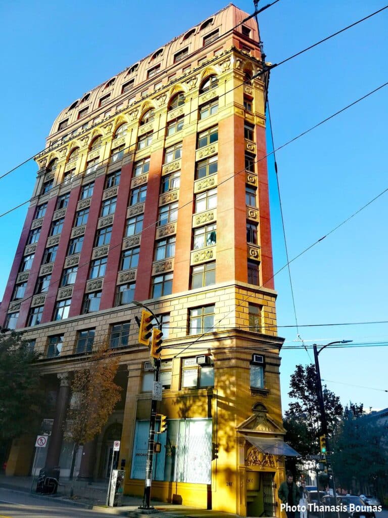 Historic early twentieth century brick building at downtown street intersection in Vancouver British Columbia Canada
