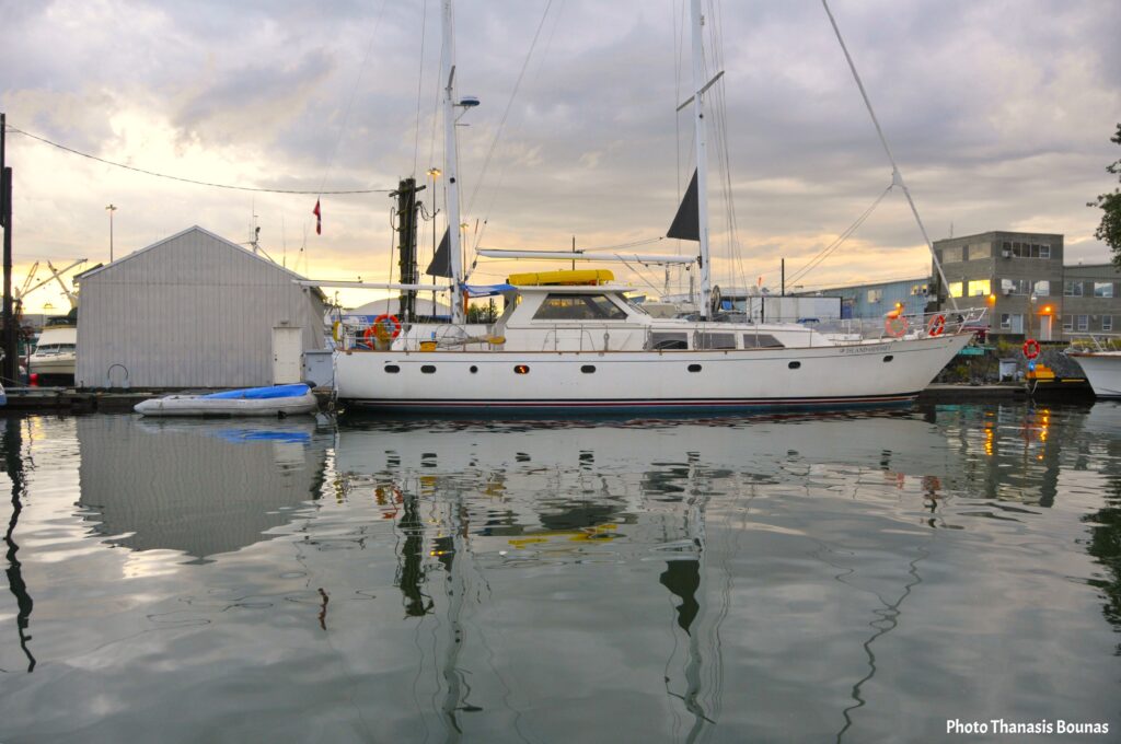 Sailboat moored at dock in False Creek harbor Vancouver British Columbia Canada