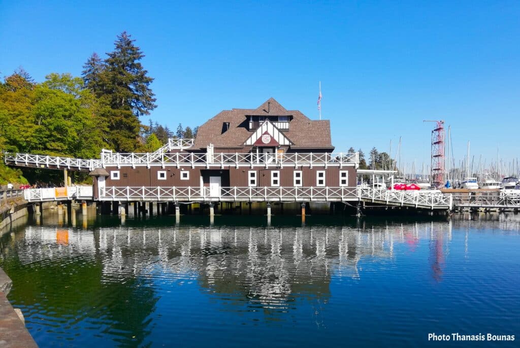 Vancouver Rowing Club building on the water with marina and reflections in Vancouver British Columbia Canada

