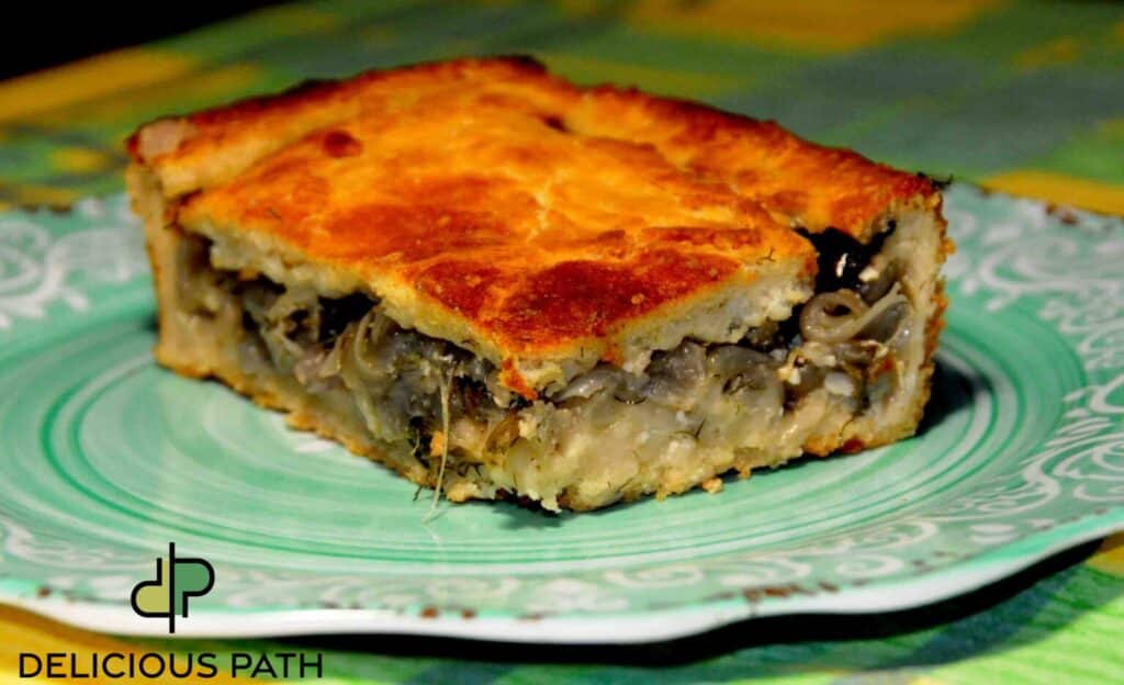 Slice of homemade onion pie with golden crust symbolizing nurturing care and slow preparation during travel