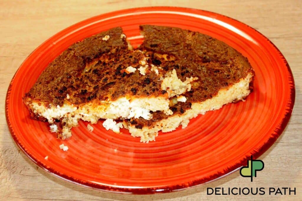 Homemade baked pie slice on red plate symbolizing hope, renewal, and simple nourishment during travel