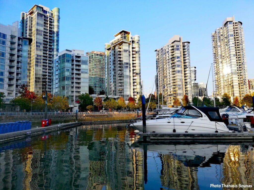Boats at marina False Creek with modern residential towers Vancouver British Columbia Canada