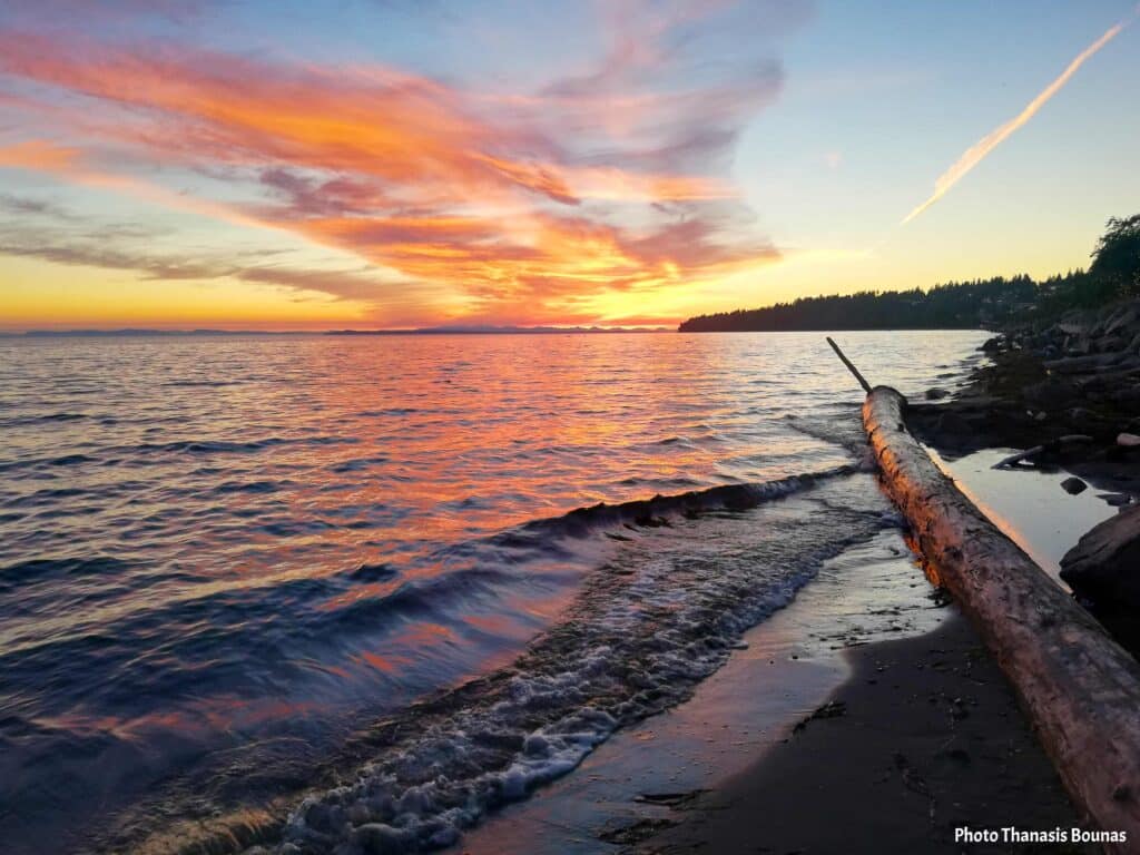 White Rock beach sunset with colorful sky and waves on the shore
