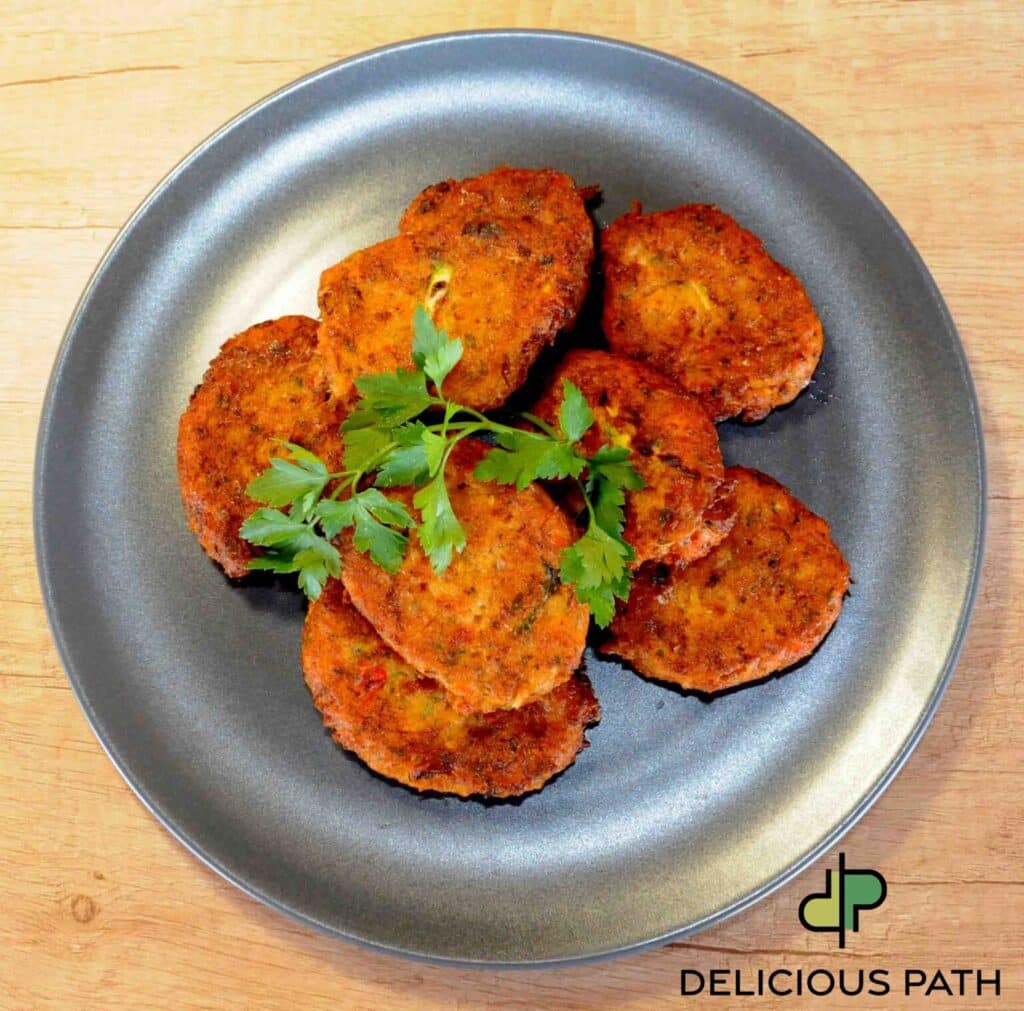 Golden cauliflower fritters on dark plate symbolizing choice, direction and Sailing philosophy in food psychology