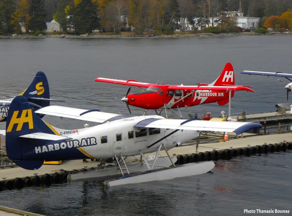 Harbour Air seaplanes docked at Vancouver Harbour floatplane terminal Vancouver British Columbia Canada
