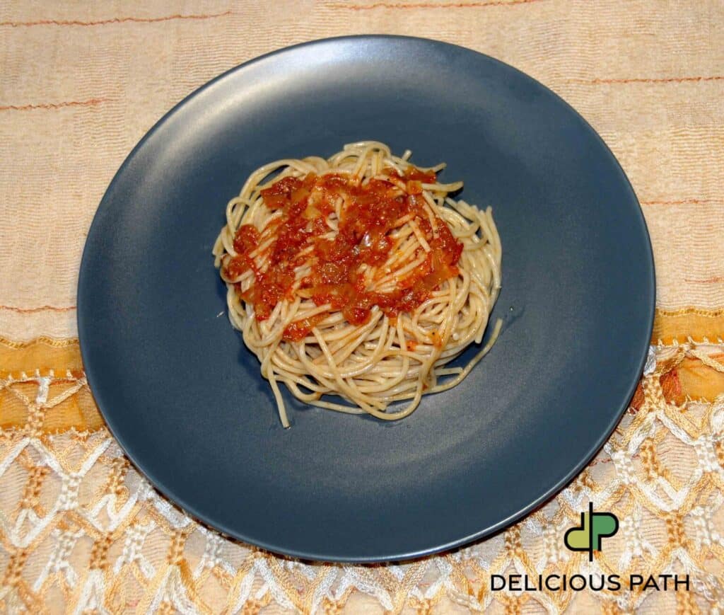 Whole wheat pasta with tomato sauce symbolizing Touch, balance, and the psychology of Sailing and travel