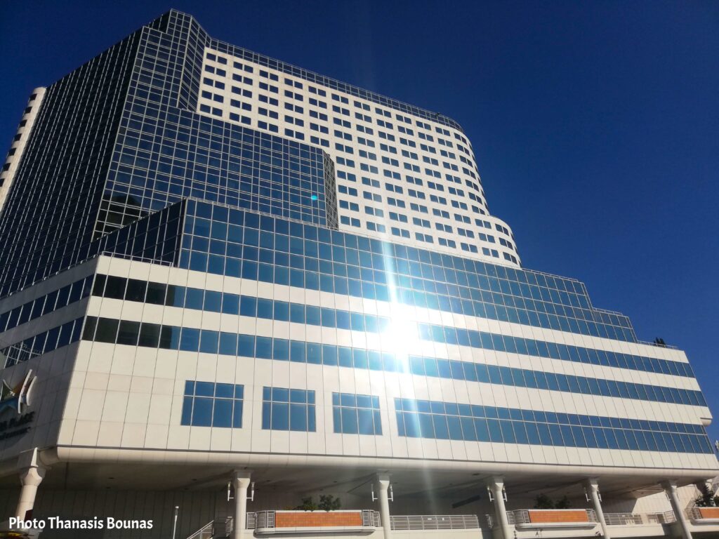 Canada Place Vancouver modern waterfront building with sunlight reflection and harbor view