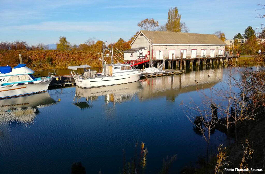 Small fishing boats at Scotch Pond in Garry Point Park, Steveston, Richmond BC, reflecting travel and maritime history