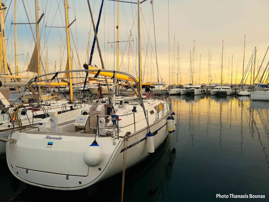 Sailboat resting in a marina at sunset symbolizing vulnerability, sailing, travel, and the psychology of the journey
