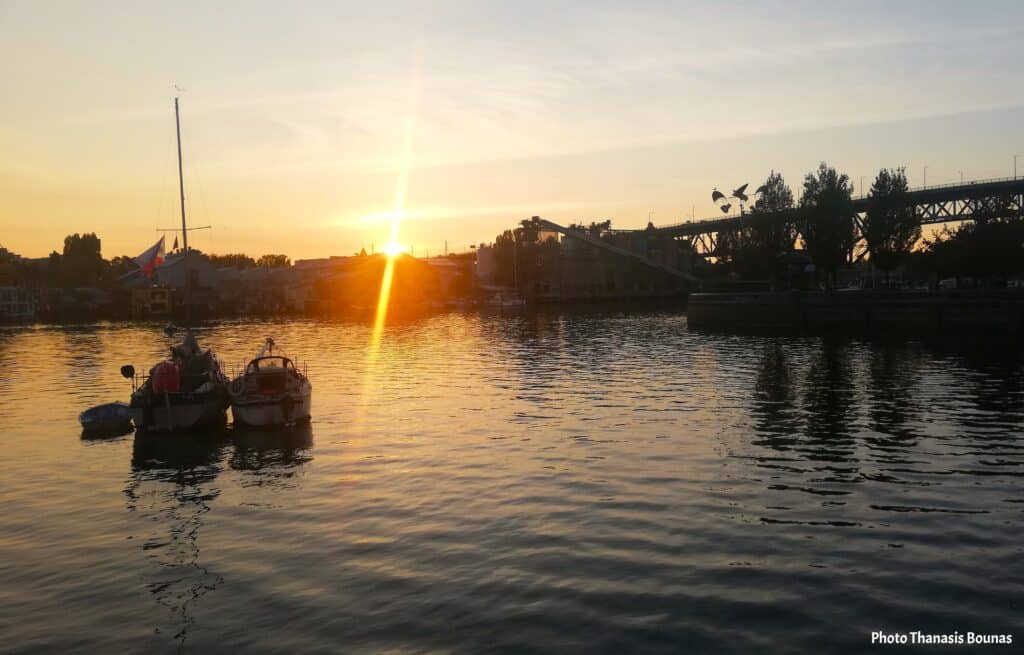 Sailboats resting on calm water during sunset at False Creek in Vancouver