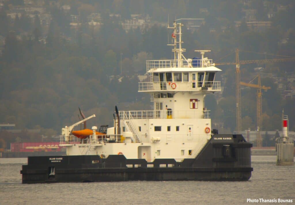 Professional harbor vessel navigating in Vancouver harbor