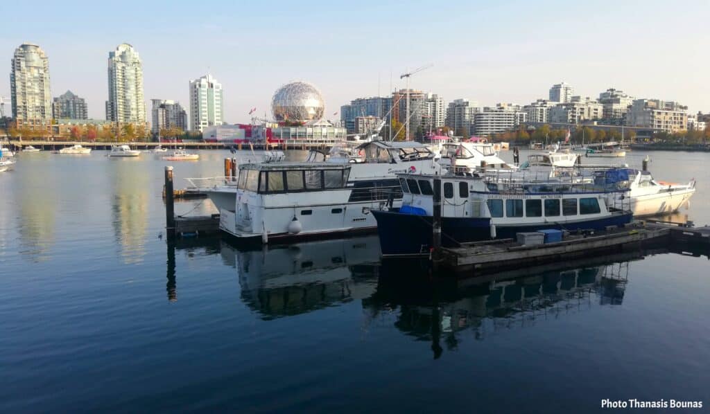 Boats resting in False Creek with Science World in the background Vancouver