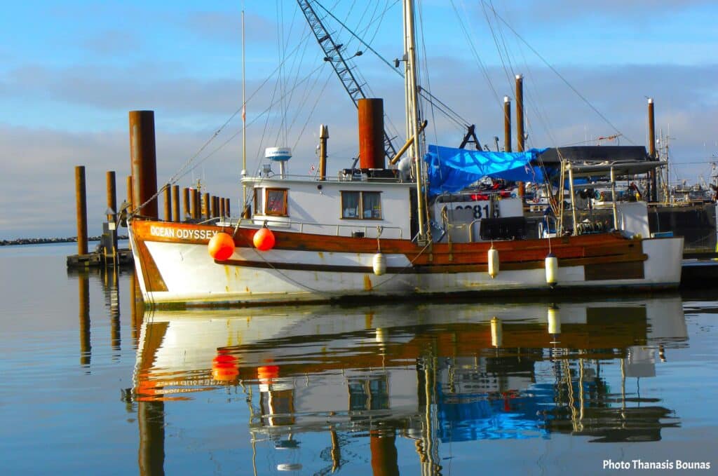 Working fishing boat docked at a Canadian marina during a calm travel moment by the sea