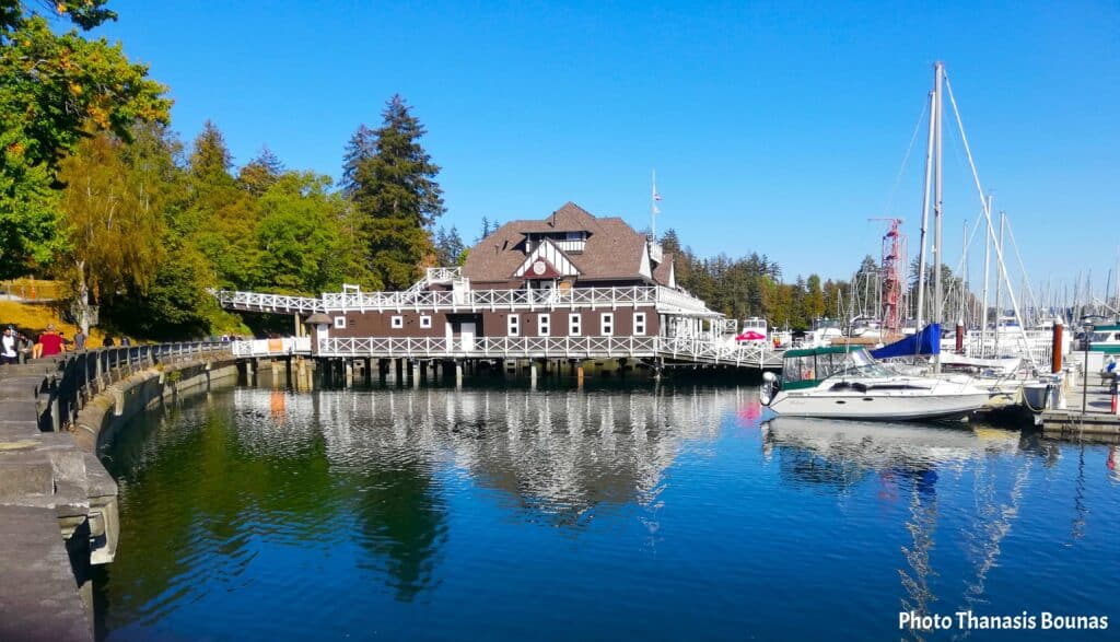 Vancouver Rowing Club building with sailboats in Coal Harbour Vancouver