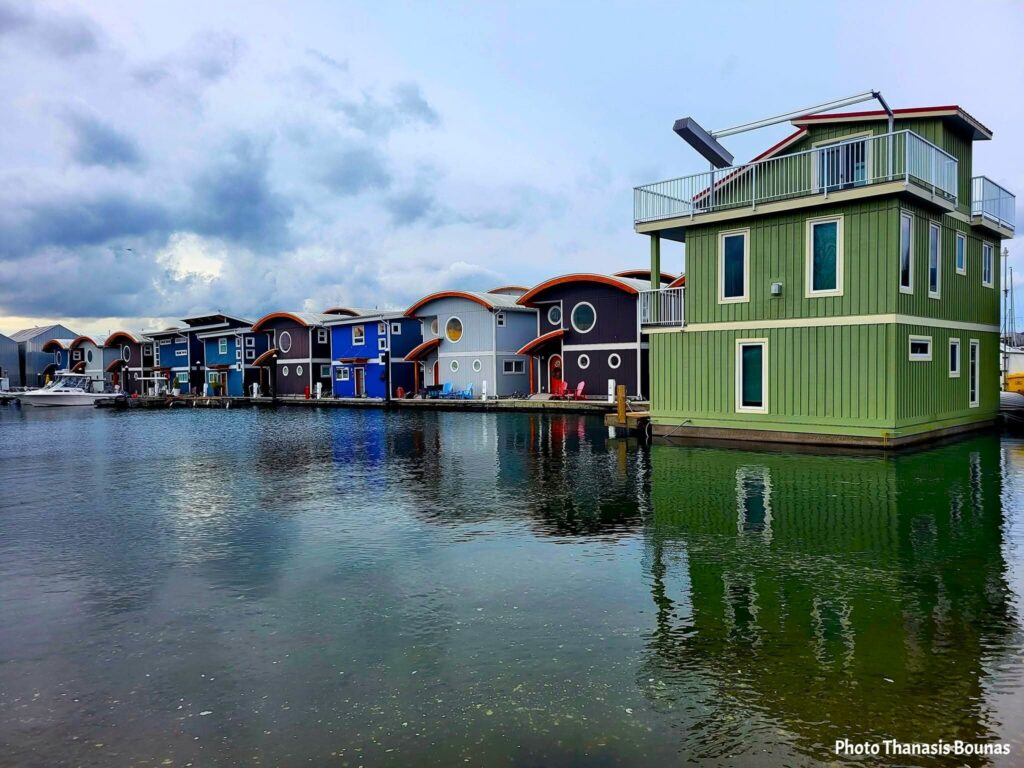 Colorful floating homes at Mosquito Creek Marina in North Vancouver during a reflective travel exploration