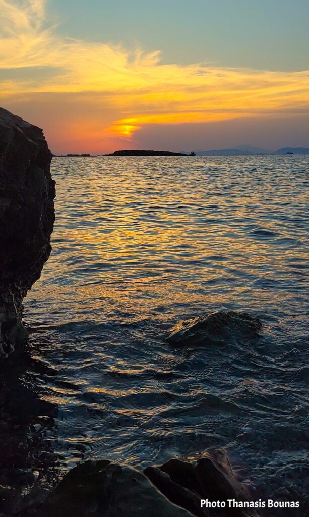 Sunset over the Aegean Sea from the rocky coast of Kalymnos, Greece