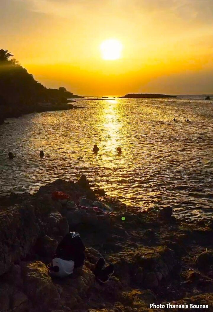 Swimming until sunset in the Cyclades as the last golden light reflects across the Aegean Sea. Photo by Thanasis Bounas.
